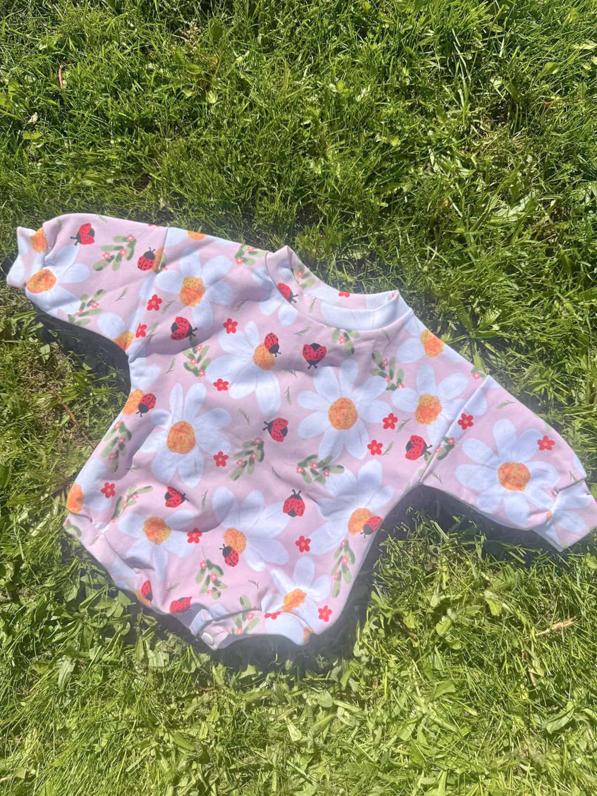 Reeses Little Pieces “Ladybug Floral” Romper
