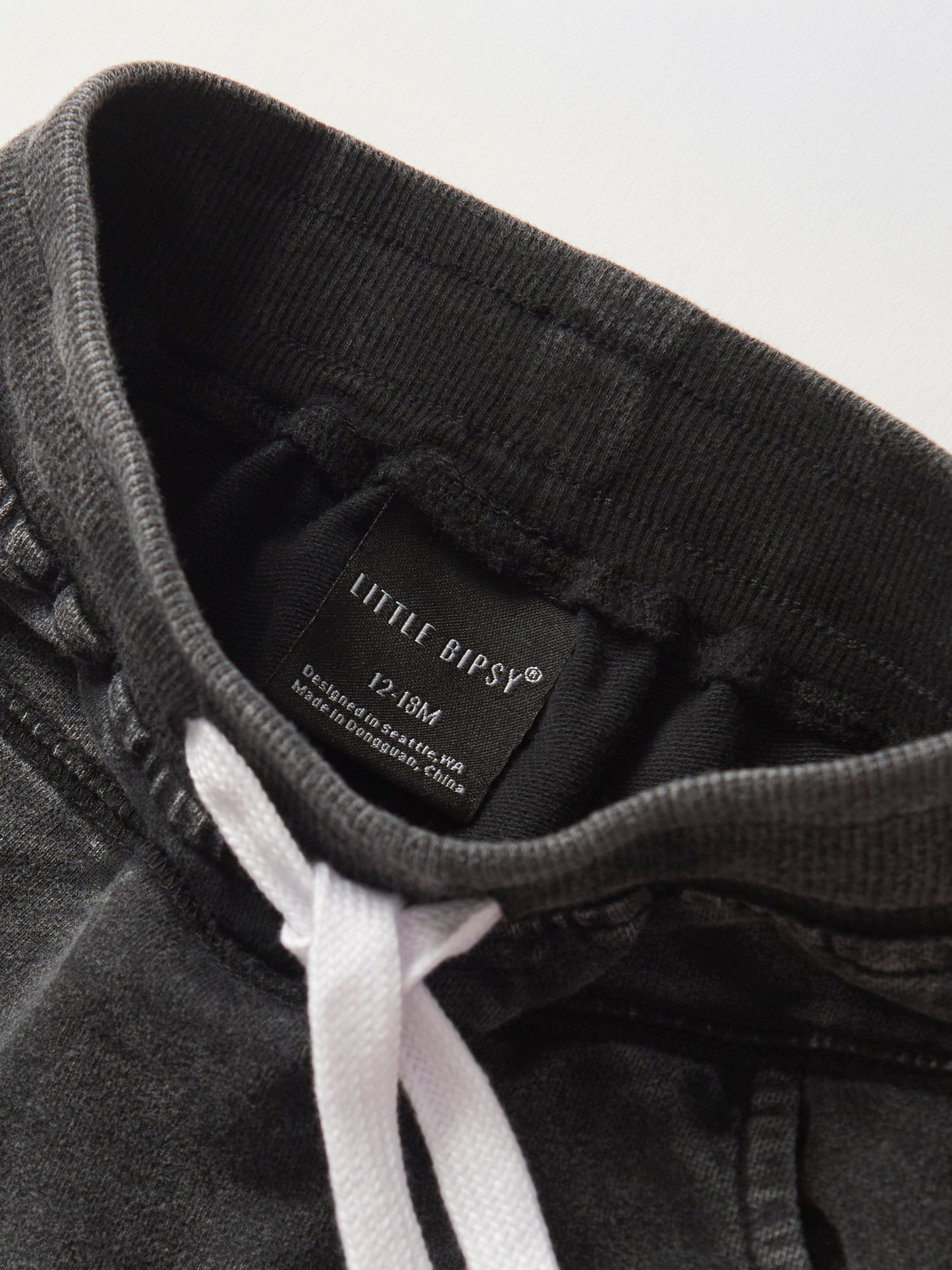 Little Bipsy Acid Wash Raw Edge Harem Short in Black
