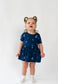 Belan J Bamboo Short Sleeve Skirted Onesie in Blueberries