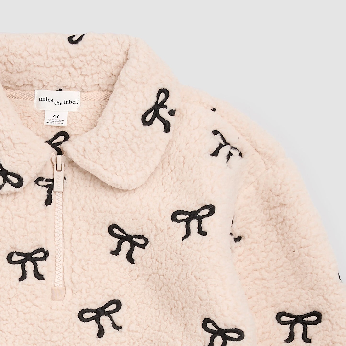 Miles the Label Half Zip Pullover in Beige Embroidered Bows
