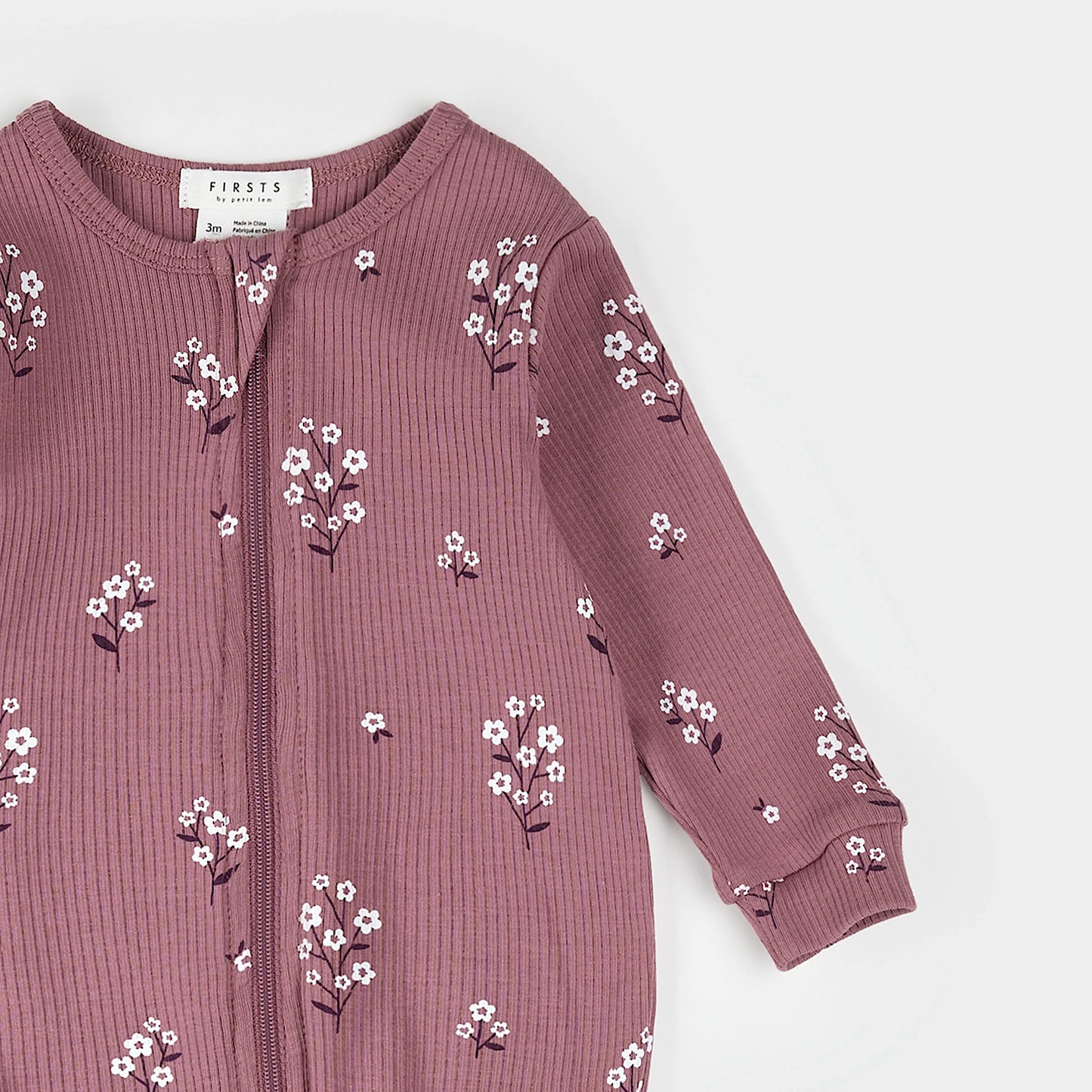 Petit Lem Footed Sleeper in White Flowers on Mauve